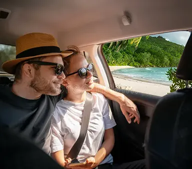 travelers sitting car back seat looking out window 249619602